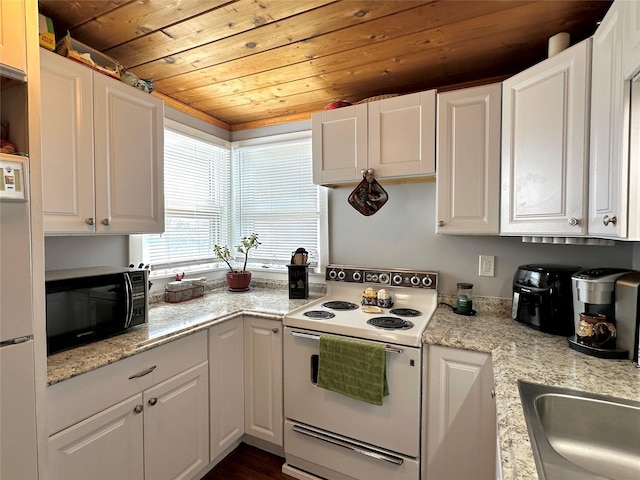kitchen with black microwave, white electric range, wooden ceiling, and white cabinets