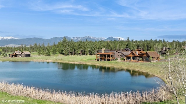 view of water feature featuring a mountain view and a view of trees