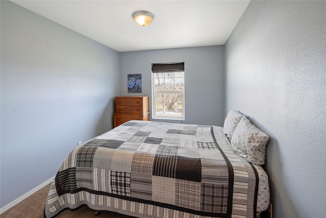 carpeted bedroom with baseboards