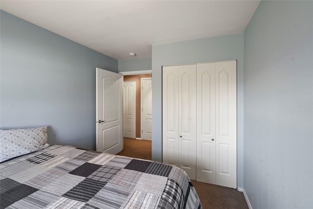 bedroom featuring carpet floors, a closet, and baseboards