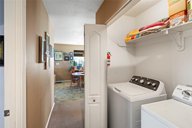 laundry area with baseboards, carpet flooring, laundry area, and washer and dryer
