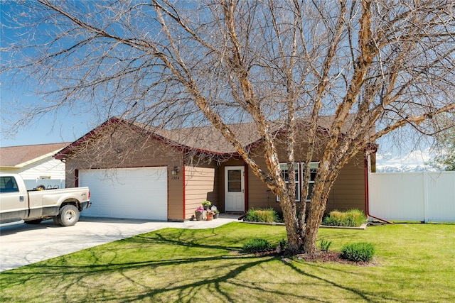 ranch-style house with fence, an attached garage, a front lawn, and driveway