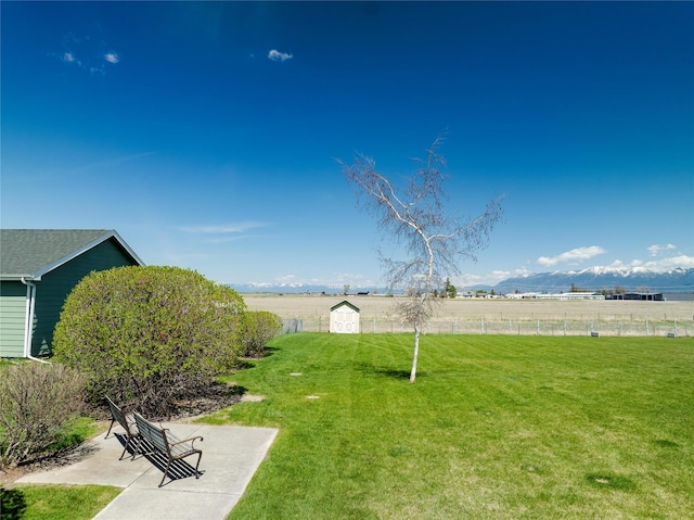 view of yard with a rural view