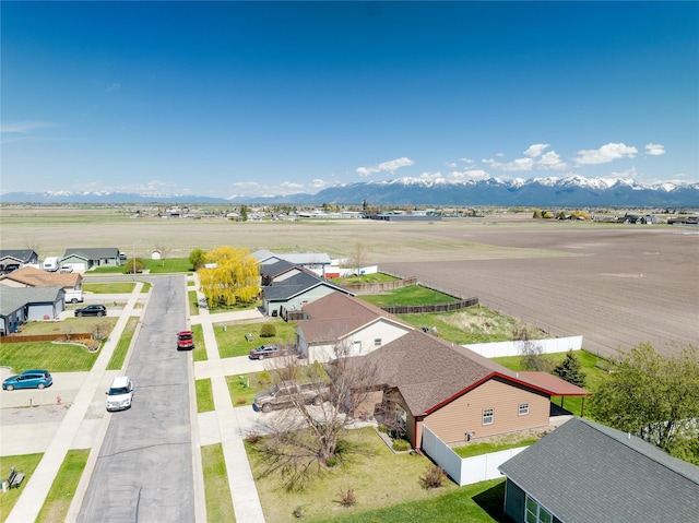 drone / aerial view with a mountain view and a residential view