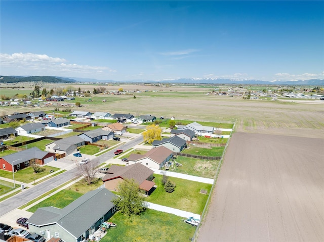 drone / aerial view with a residential view and a mountain view