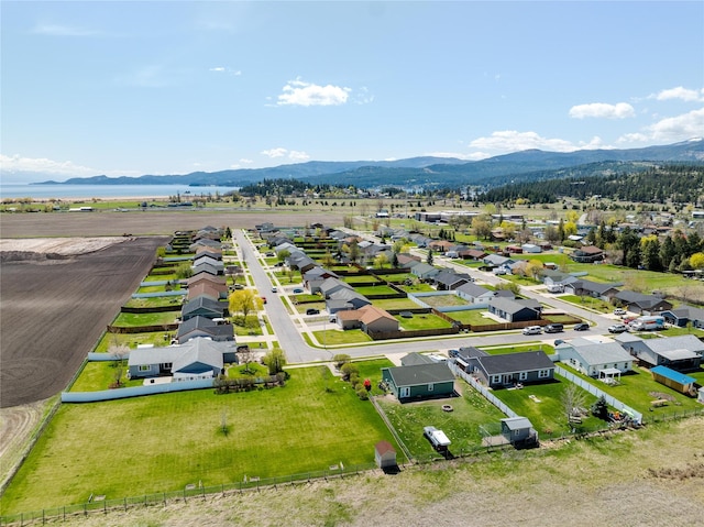 birds eye view of property with a mountain view and a residential view