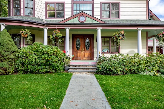 305 Columbia Ave, Whitefish, MT 59937 - property entrance featuring covered porch, a lawn, and a shingled roof