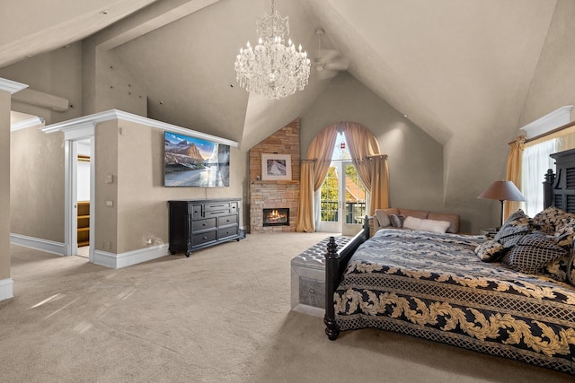 305 Columbia Ave, Whitefish, MT 59937 - bedroom with a fireplace, carpet floors, high vaulted ceiling, a chandelier, and access to exterior