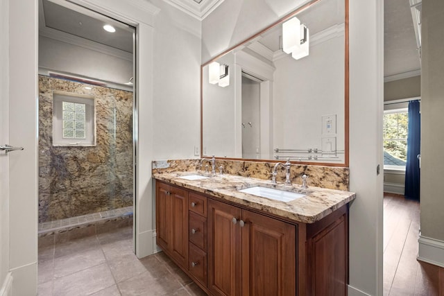 305 Columbia Ave, Whitefish, MT 59937 - bathroom featuring crown molding, a stall shower, and double vanity