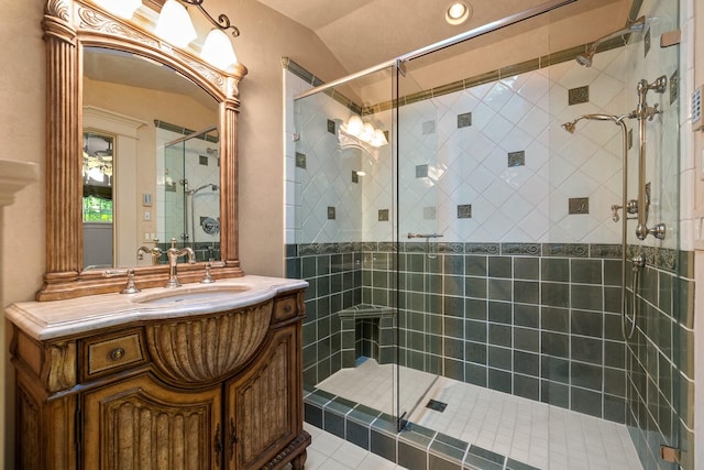 305 Columbia Ave, Whitefish, MT 59937 - bathroom with a shower stall, vanity, lofted ceiling, and tile patterned floors