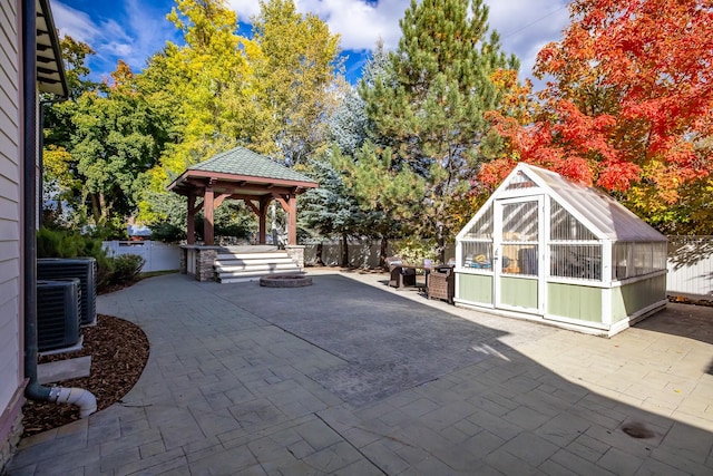 305 Columbia Ave, Whitefish, MT 59937 - view of patio / terrace featuring a greenhouse, a gazebo, and an outbuilding