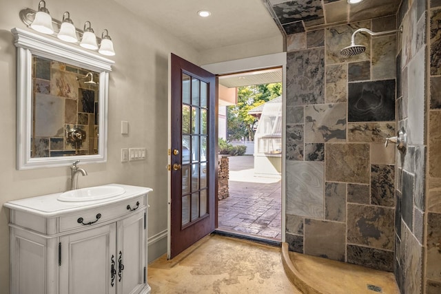 305 Columbia Ave, Whitefish, MT 59937 - bathroom with tiled shower, vanity, and recessed lighting
