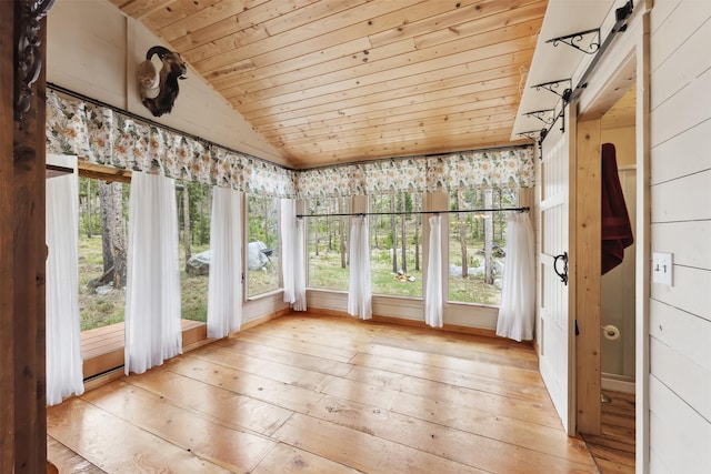 1441 Bonanza Dr, Sula, MT 59871 - unfurnished sunroom featuring wooden ceiling, hardwood / wood-style flooring, and vaulted ceiling