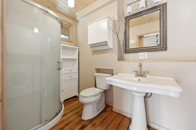 1441 Bonanza Dr, Sula, MT 59871 - bathroom with wood ceiling, a shower stall, wood finished floors, and toilet