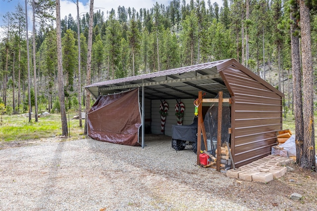 1441 Bonanza Dr, Sula, MT 59871 - view of vehicle parking with a forest view and a detached carport