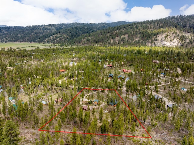 1441 Bonanza Dr, Sula, MT 59871 - view of property location featuring property parcel outlined, a forest, and a mountain backdrop