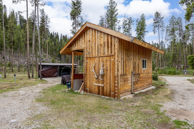 1441 Bonanza Dr, Sula, MT 59871 - view of outbuilding featuring a view of trees