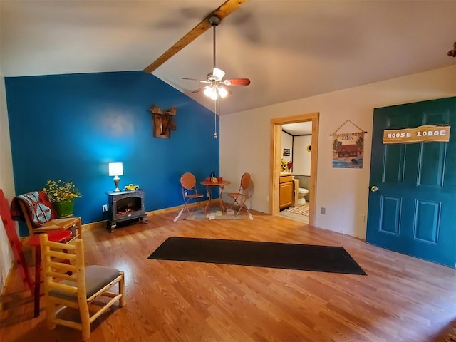 4056 Snow Fleury Ln, Lincoln, MT 59639 - entryway featuring lofted ceiling, wood finished floors, a wood stove, and a ceiling fan