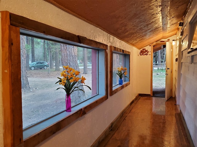 4056 Snow Fleury Ln, Lincoln, MT 59639 - hall featuring lofted ceiling and baseboards