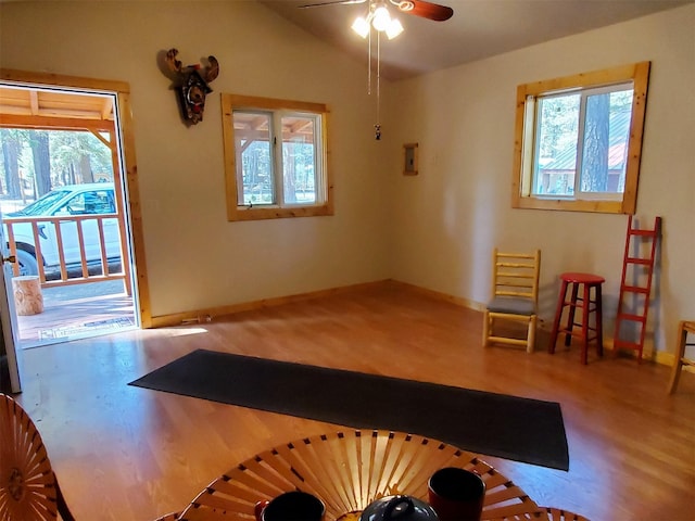 4056 Snow Fleury Ln, Lincoln, MT 59639 - living area featuring a ceiling fan, wood finished floors, vaulted ceiling, and baseboards