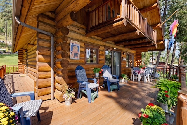 662 S Foys Lake Dr, Kalispell, MT 59901 - wooden terrace featuring outdoor dining area