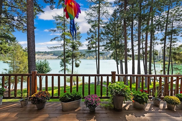 662 S Foys Lake Dr, Kalispell, MT 59901 - wooden deck featuring a water view