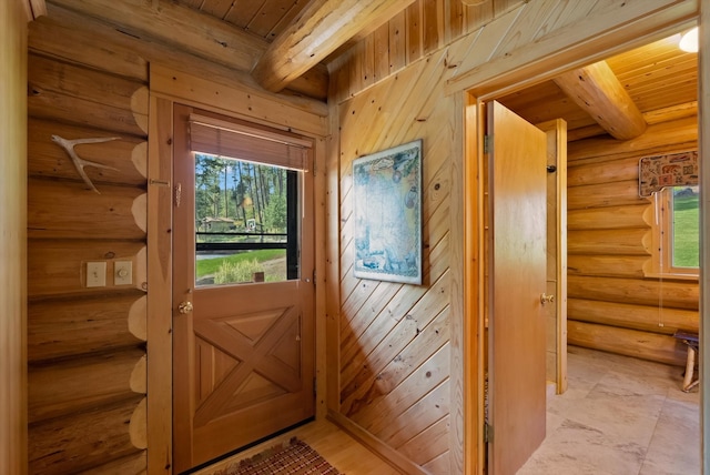 662 S Foys Lake Dr, Kalispell, MT 59901 - doorway to outside with log walls and a wood ceiling with exposed beams
