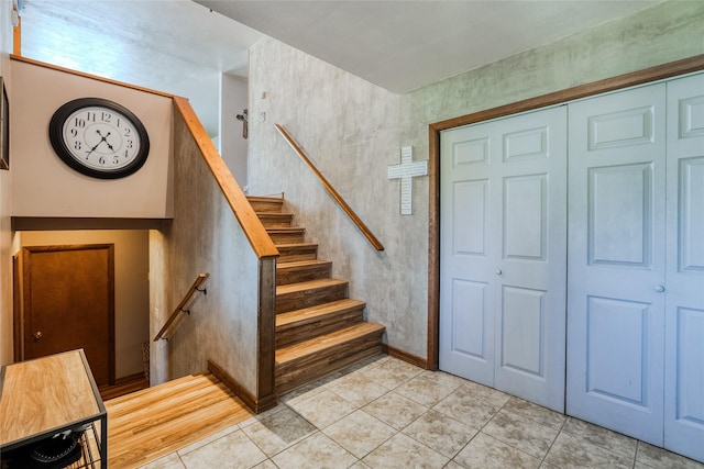 stairs featuring tile patterned floors