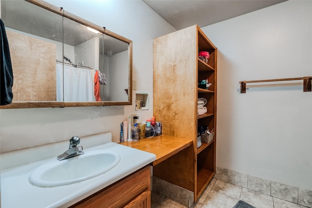 bathroom with vanity and curtained shower