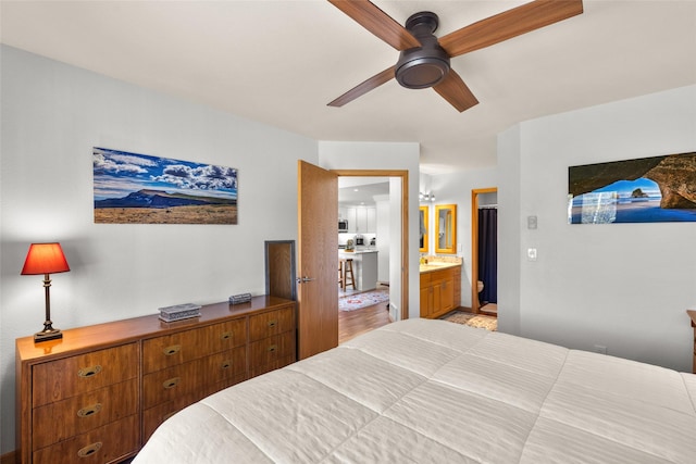 bedroom with a ceiling fan and ensuite bathroom
