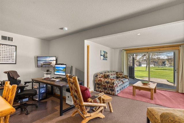 carpeted office space with visible vents