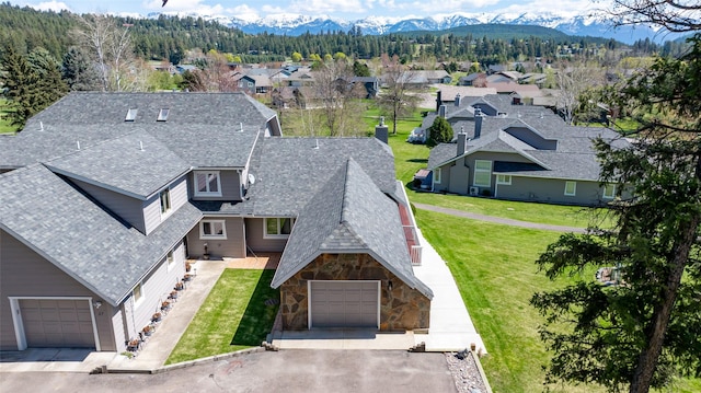 drone / aerial view with a mountain view and a residential view