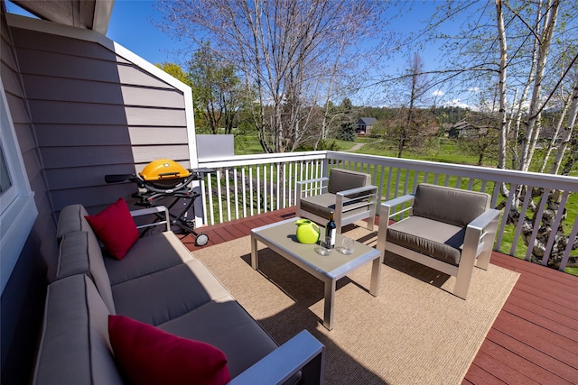 wooden deck featuring an outdoor hangout area