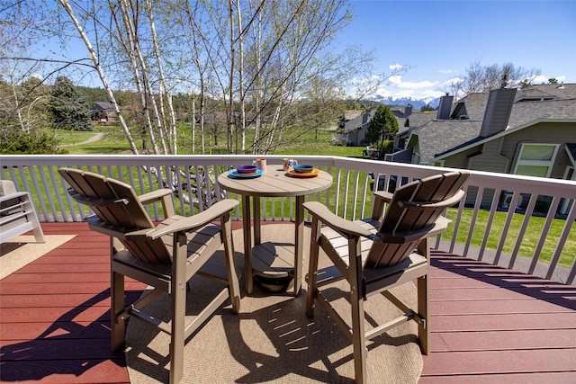 wooden deck with a yard
