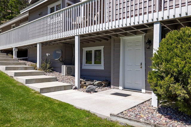 view of exterior entry featuring ac unit