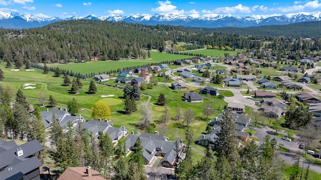 bird's eye view with a forest view, a mountain view, and a residential view