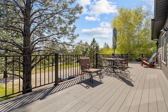 deck featuring outdoor dining area
