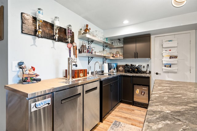 kitchen with a sink, open shelves, light wood-style floors, wine cooler, and recessed lighting