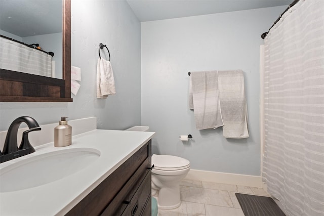 full bathroom featuring marble look tile flooring, vanity, toilet, and baseboards