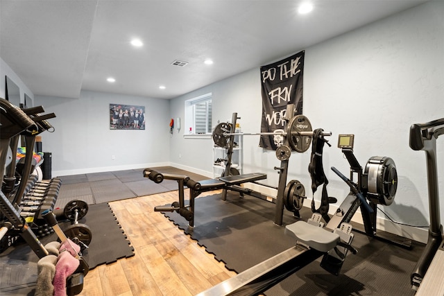 exercise area featuring recessed lighting and baseboards
