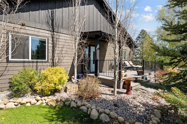 view of front of house with a deck and board and batten siding