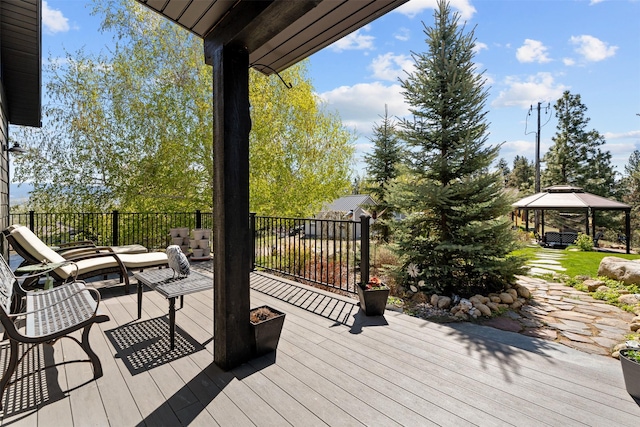 wooden deck featuring a gazebo and an outdoor hangout area