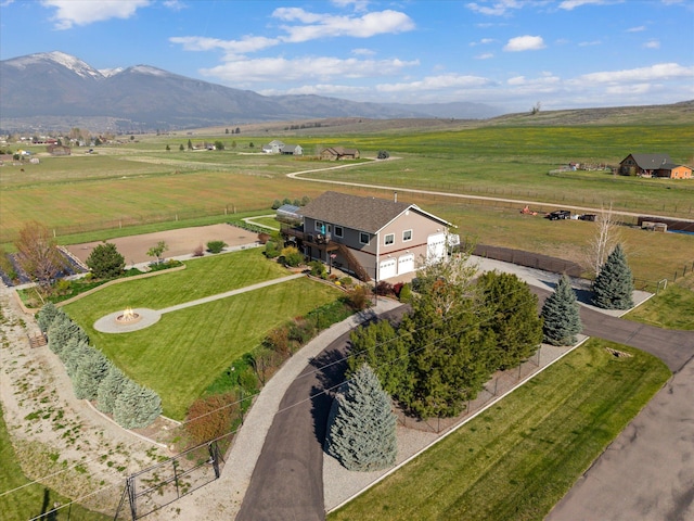 drone / aerial view featuring a mountain view and a rural view