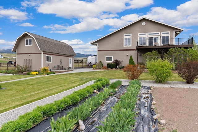 deck with a rural view and a mountain view