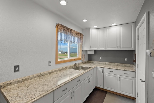 kitchen featuring a peninsula, stainless steel appliances, open shelves, high vaulted ceiling, and beverage cooler