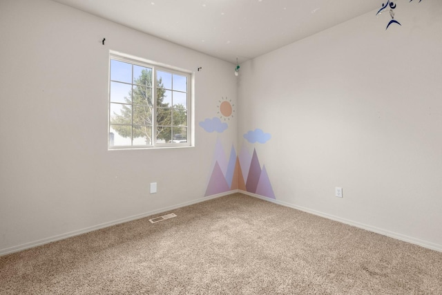 carpeted empty room with baseboards and visible vents