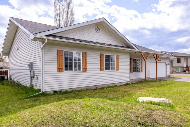 view of front of home with central air condition unit, an attached garage, a front lawn, and driveway