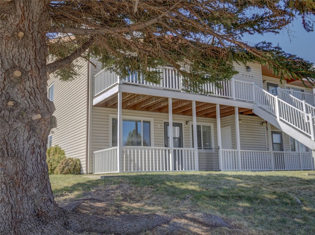back of house with a yard