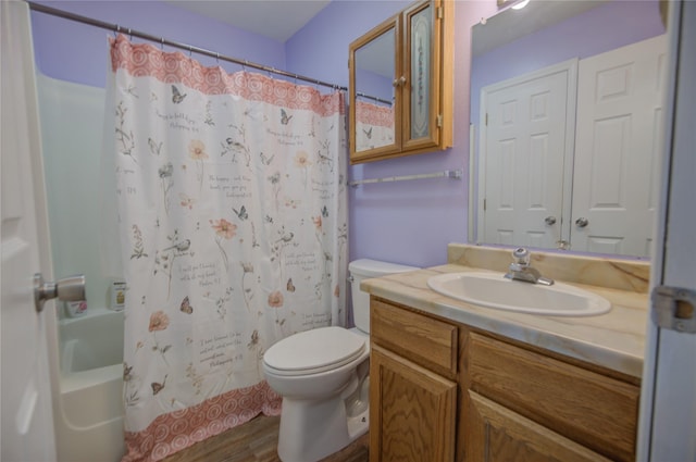 bathroom featuring shower / bath combo with shower curtain, toilet, wood finished floors, and vanity