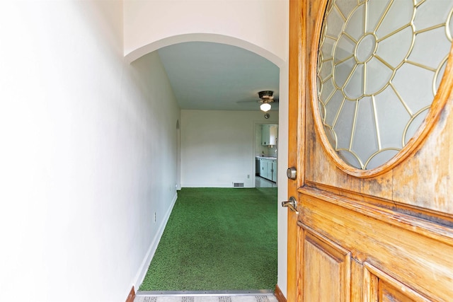 view of exterior entry with visible vents